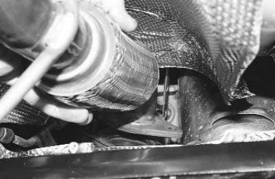 2. Unscrew the two nuts securing the intake pipe flange to the exhaust manifold flange…