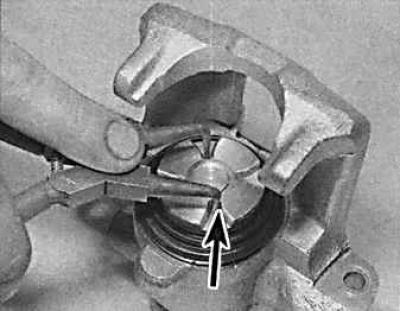 8. Remove the brake pads.