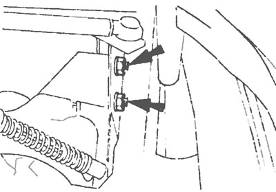 Рис.27.32. Отвинтите две фиксирующие гайки (указаны стрелками) и снимите фиксирующий кронштейн…