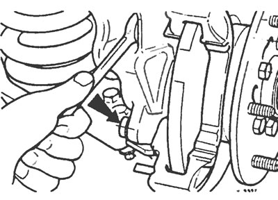 Рис. 5.5. Отвинтите два винта (один из которых указан стрелкой) и снимите направляющую колодок…